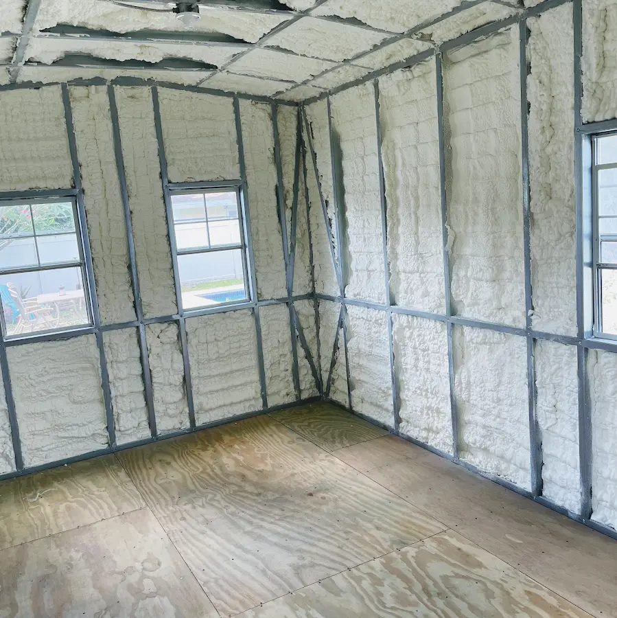 Closed-cell spray foam insulation applied to wall cavities in a residential project in Alpine